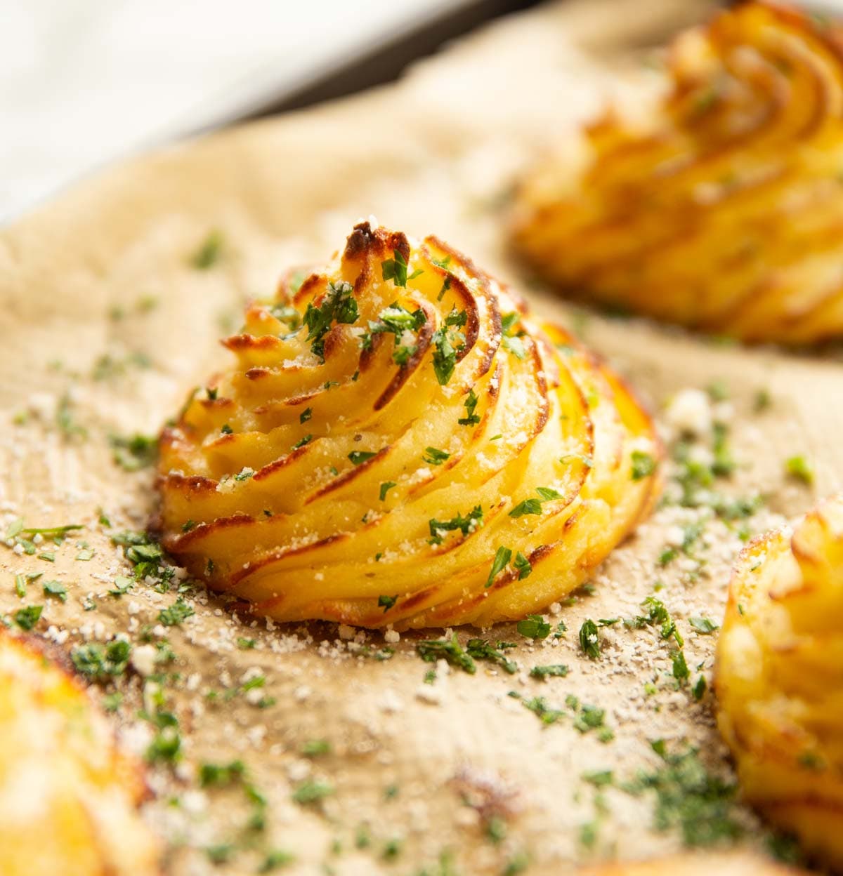 Garlic Parmesan Duchess Potatoes with Roasted Garlic